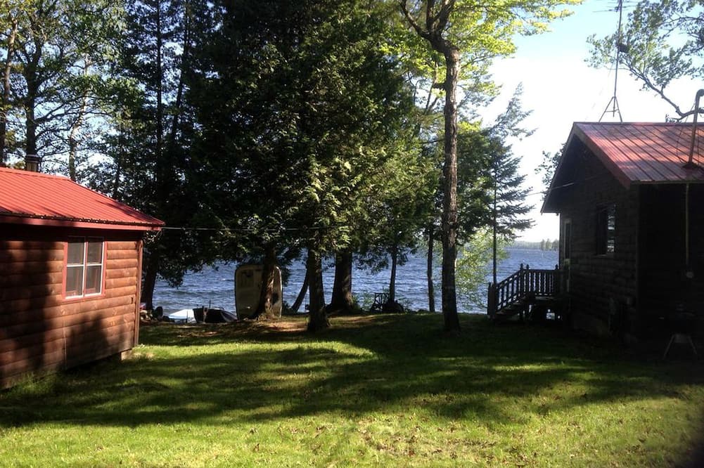 Brownville Cabin | Charming Lakefront Cabin Rental with a Fire Pit near Brownville, Maine