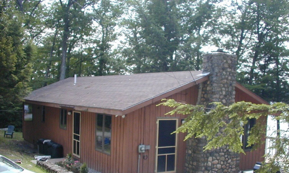 Harrison House | Cozy waterfront cottage on private land with beautiful sunsets over Long Lake