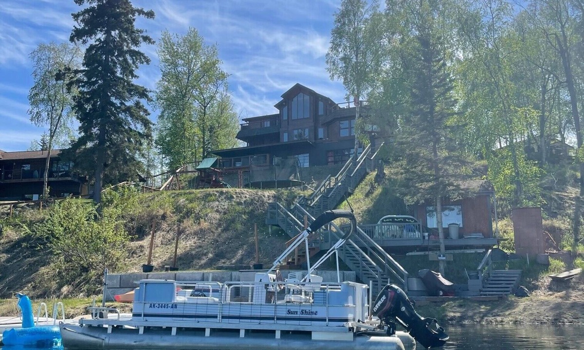 Sand Lake House | Large luxurious lakefront home with water toys & mountain view