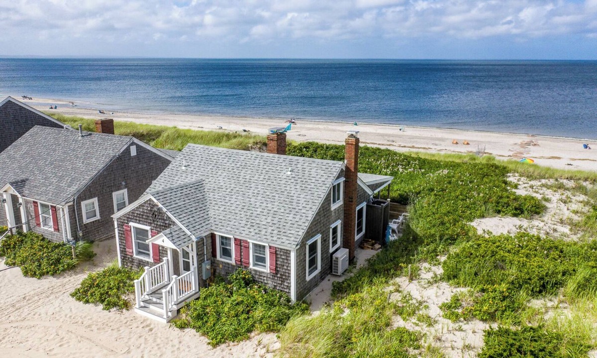 East Sandwich Cottage | Ocean front oasis with renovation nestled in the dune on a private beach.