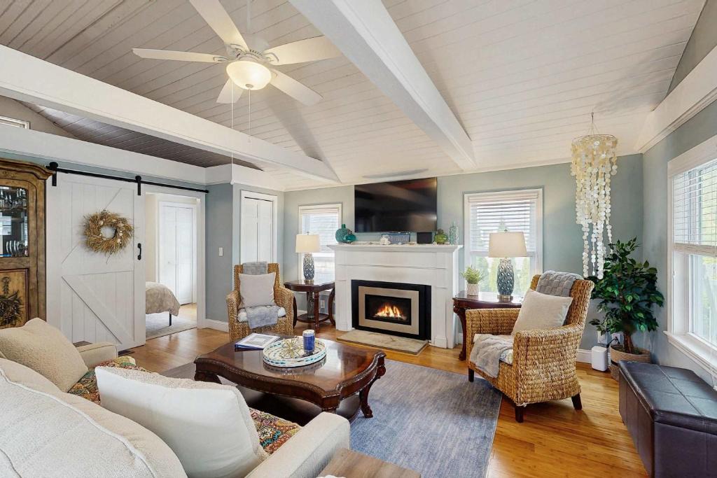 Pocasset House | Peaceful marshview escape with large sunroom AC outdoor firepit & dog friendly