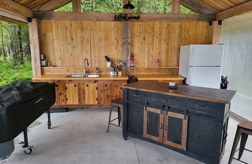 Allagash Cabin | Allagash Elevated Escape Cedar Hot Tub Outdoor Entertaining Riverfront