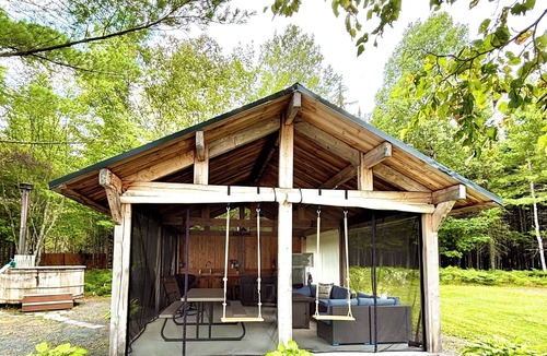 Allagash Cabin | Allagash Elevated Escape Cedar Hot Tub Outdoor Entertaining Riverfront