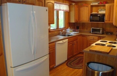 Harrison House | Cozy waterfront cottage on private land with beautiful sunsets over Long Lake