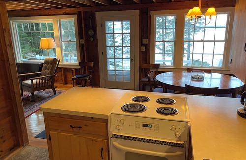 Pleasant Point House | Cozy waterfront cottage overlooking Muscongus Bay with stunning sunset views.