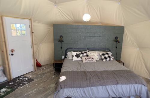 Monticello Resort | Dome 1 Blue Mountain Domes. Glamping in style. On the ground in a forest.