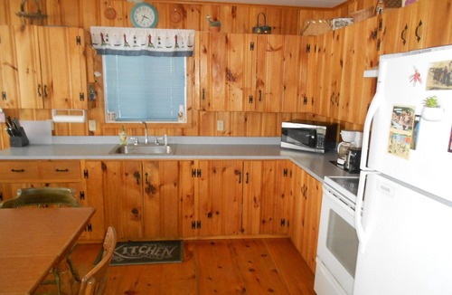 The Bays Cottage | Lakefront Cottage with 100' Sandy Beach, Dock, Views and Game Room.