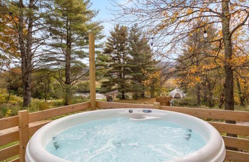 Johnson House | Modern Tiny House with hot tub & river near Stowe