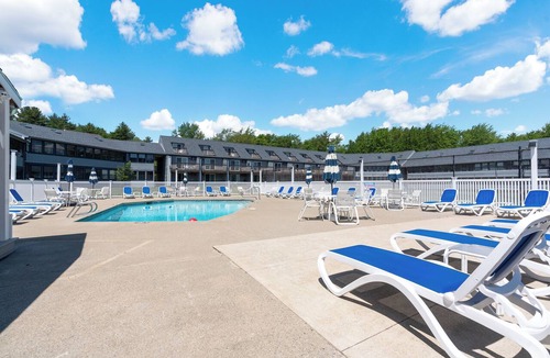 Wells Condo | Refreshing pool view condo at Nautical Mile resort Pool Tennis Courts