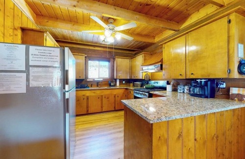 Rivers Edge House | Riverfront home with river & valley views, wood stove, deck, & W/D