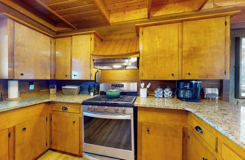 Rivers Edge House | Riverfront home with river & valley views, wood stove, deck, & W/D