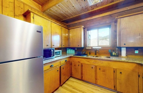 Rivers Edge House | Riverfront home with river & valley views, wood stove, deck, & W/D