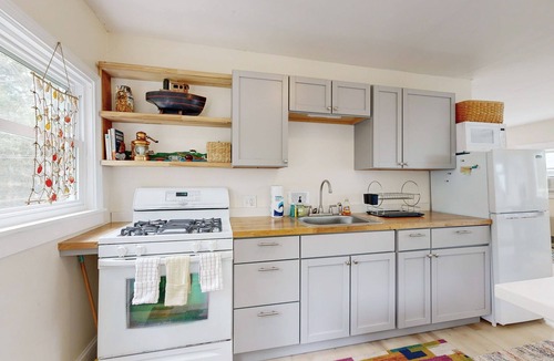 Sebasco House | Water view home with scenic balcony, grill, board games, and AC