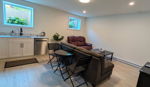 Bright & private lower level suite, with it's own garden and parking space.