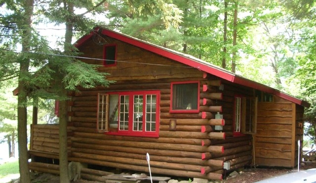 Enjoy a charming 1939 Log Cabin on gorgeous Lake George .