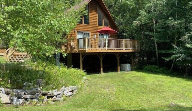 Light-Filled Log Home, 4 Wooded Acres, & Lake Access. The water is 0.4 mi away.