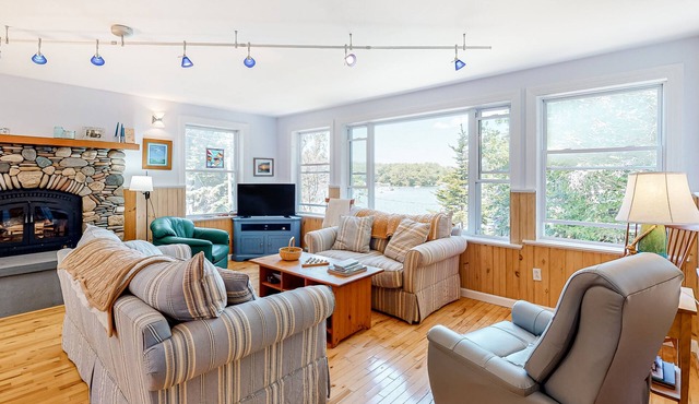 Secluded waterfront home with firepit, gas grill, kayaks, dock, balcony, & patio