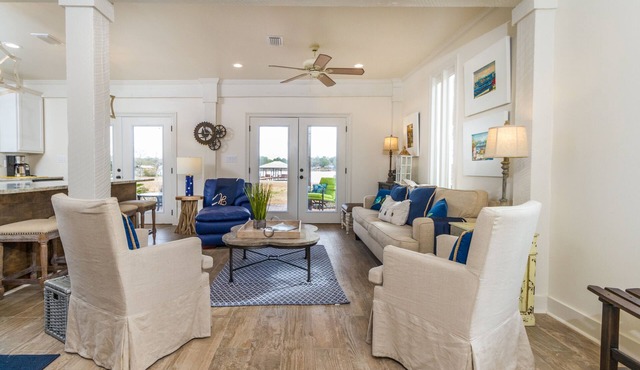 Waterfront Home on Perdido Beach in Elberta with sandy beach, pier & boat house.